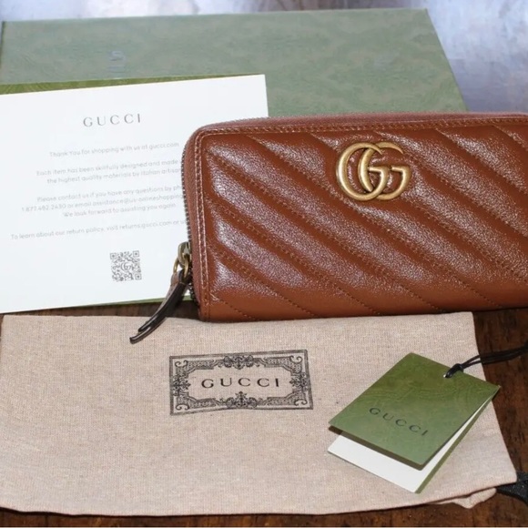 Gucci Handbags - Authentic Gucci Marmot Wallet gold hardware